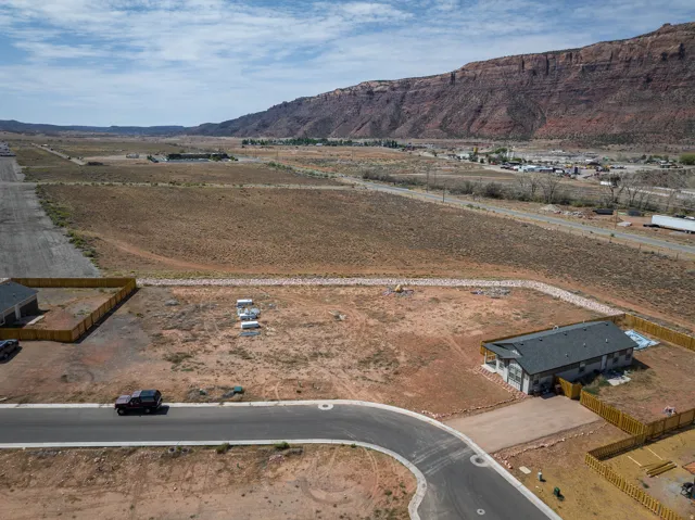 Aerial perspective showcasing a cul-de-sac lot with mountain backdrop