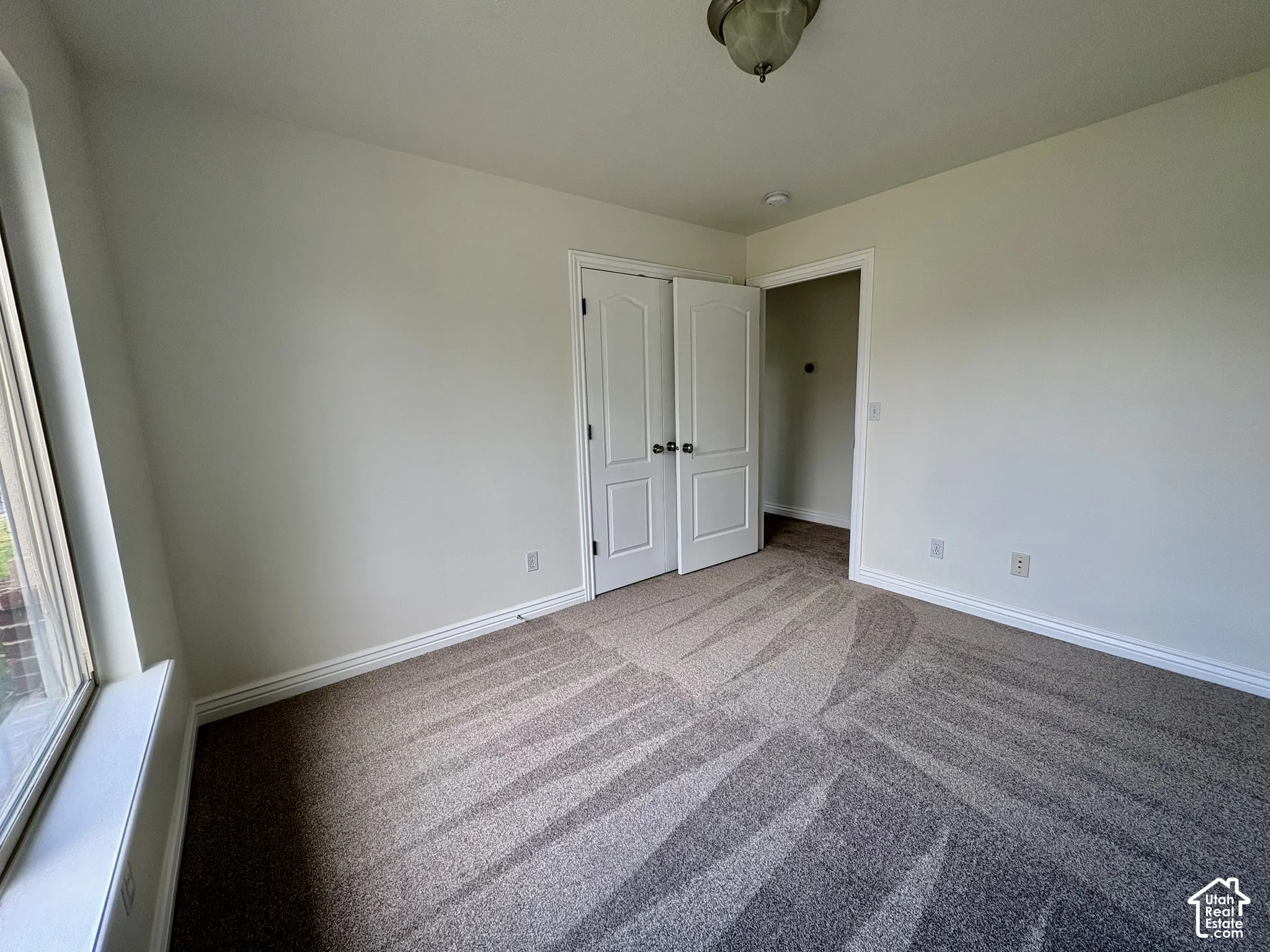 Neutral wall paint with contrasting white trim
