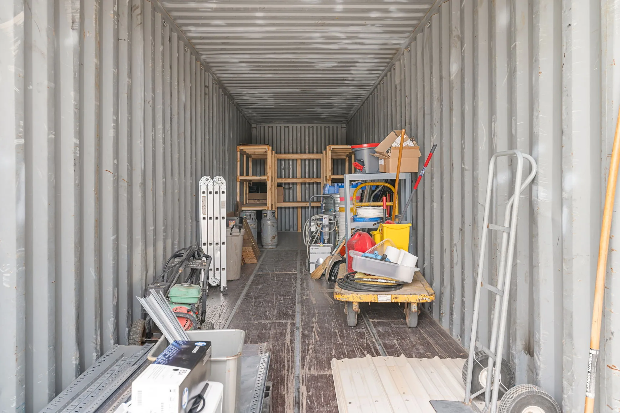 Corrugated metal interior walls and ceiling with a durable wood-finish floor
