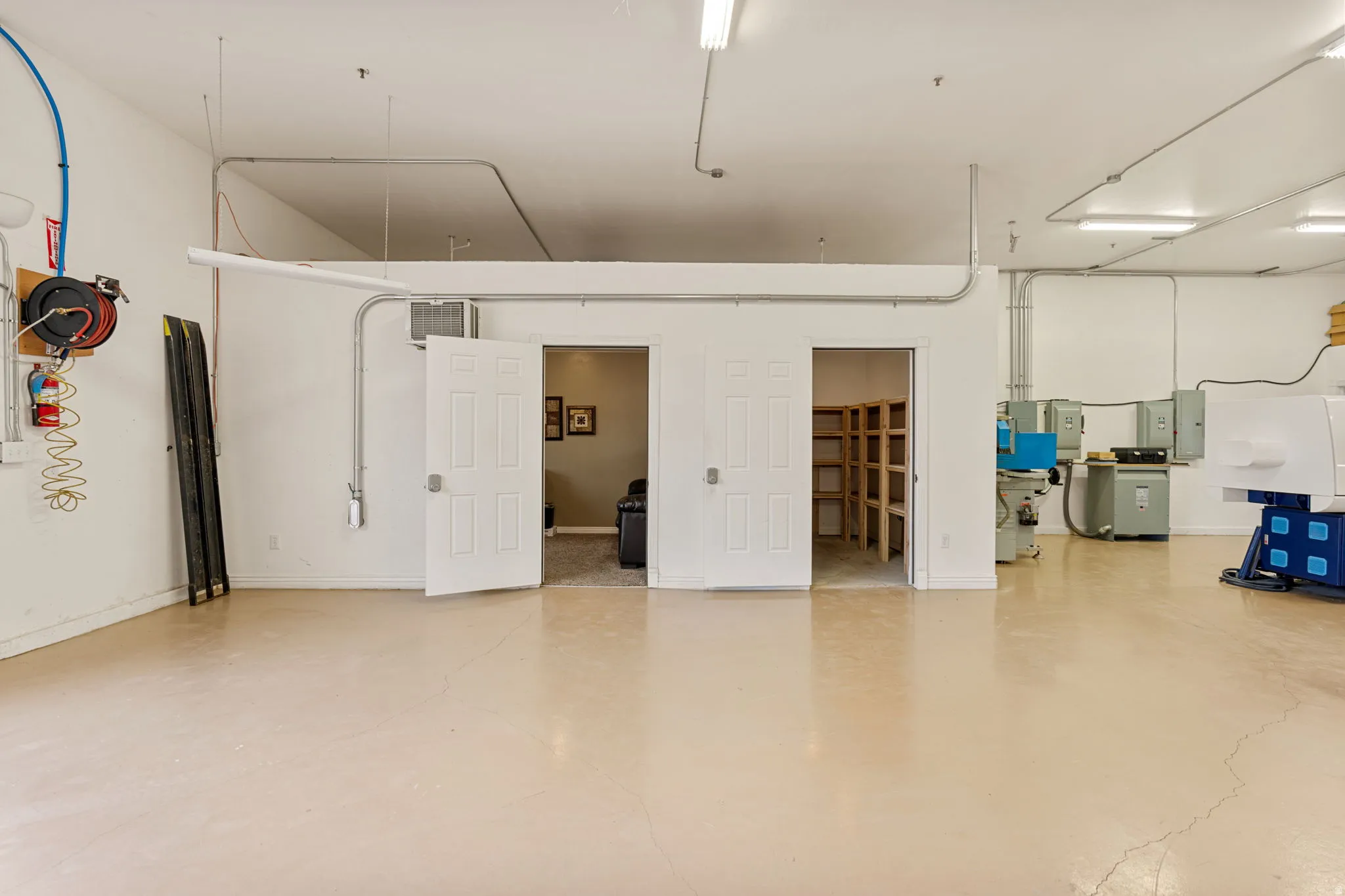 Spacious interior with light-toned flooring and white walls