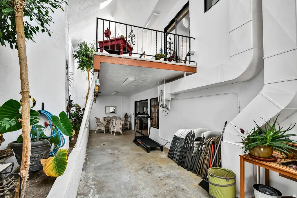 Covered patio area featuring concrete flooring and direct outdoor access