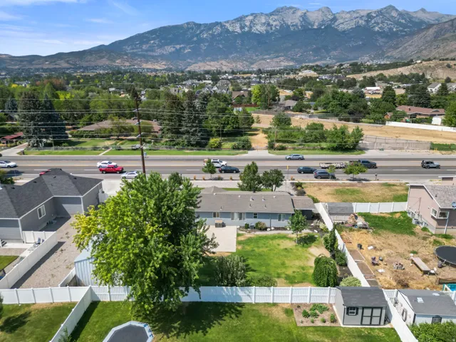 Expansive mountain range backdrop and surrounding green landscape