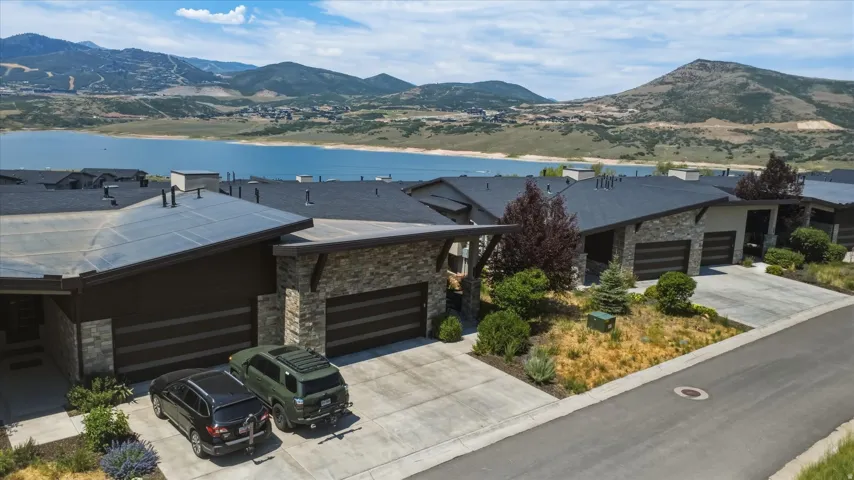 Modern residential architecture featuring stone facade accents and integrated solar panels