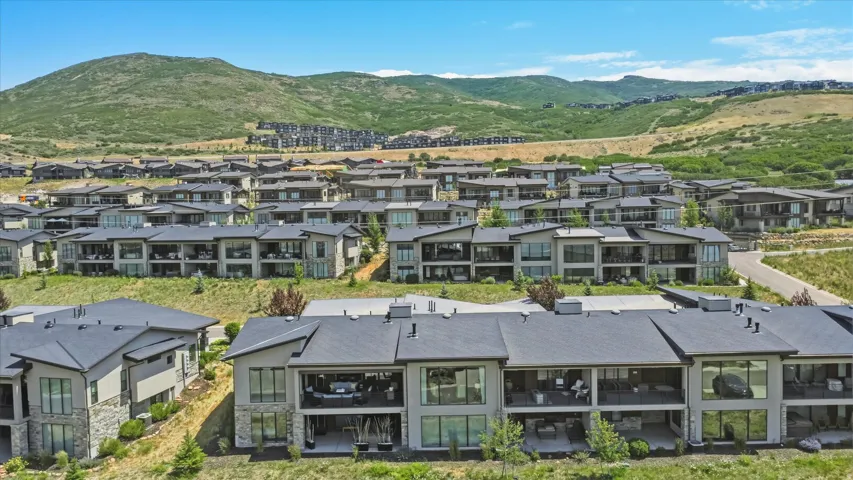 Contemporary multi-level residences featuring expansive private balconies and patios