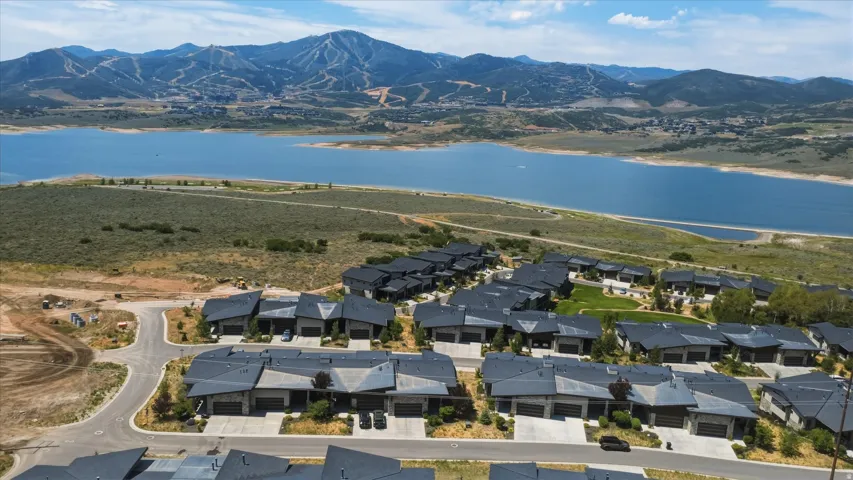 Aerial landscape showcasing a residential development with dark-toned roofs