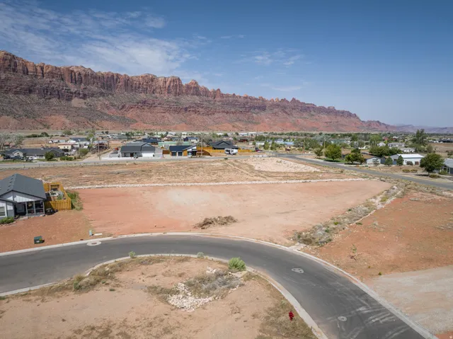 Expansive land parcel featuring direct road frontage and mountain scenery