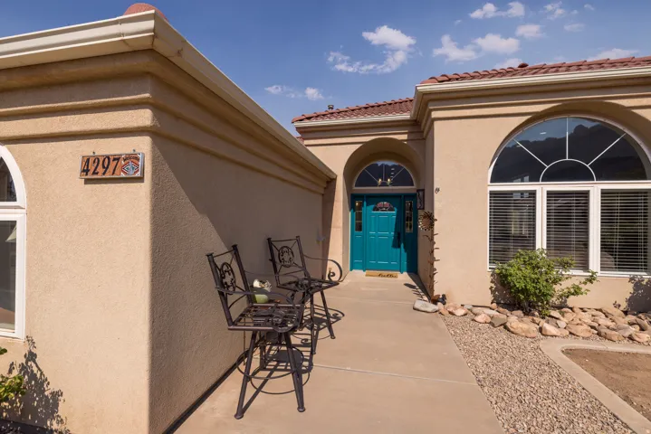 Stucco exterior with a terracotta tile roof