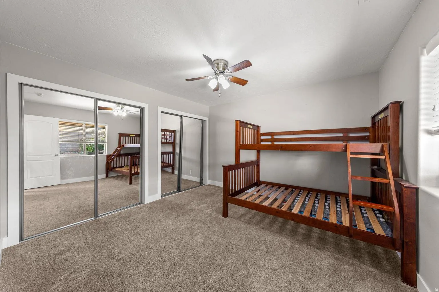 Neutral tone walls with carpeted flooring