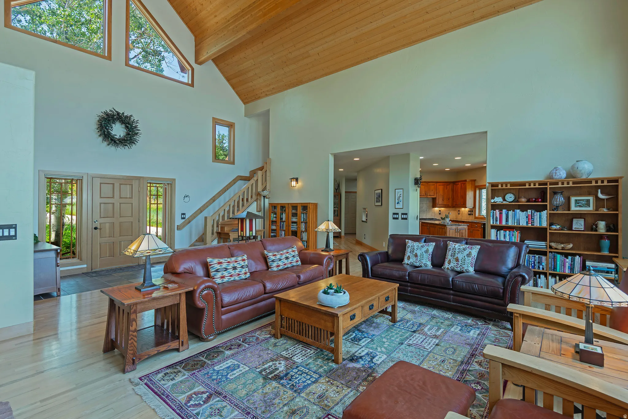Vaulted ceiling with wood-finish planks and exposed beam