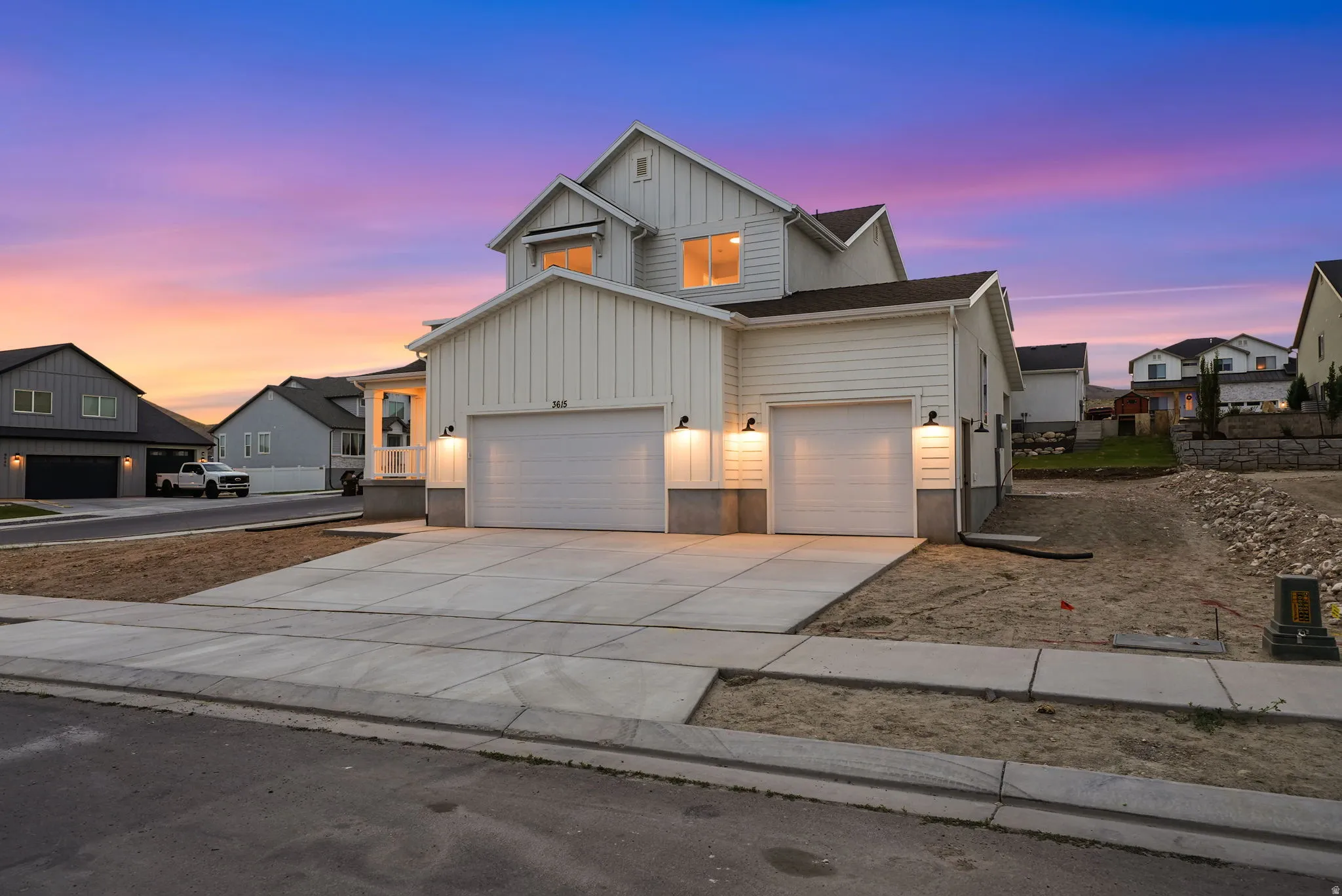 Modern farmhouse-style exterior featuring white vertical and horizontal siding