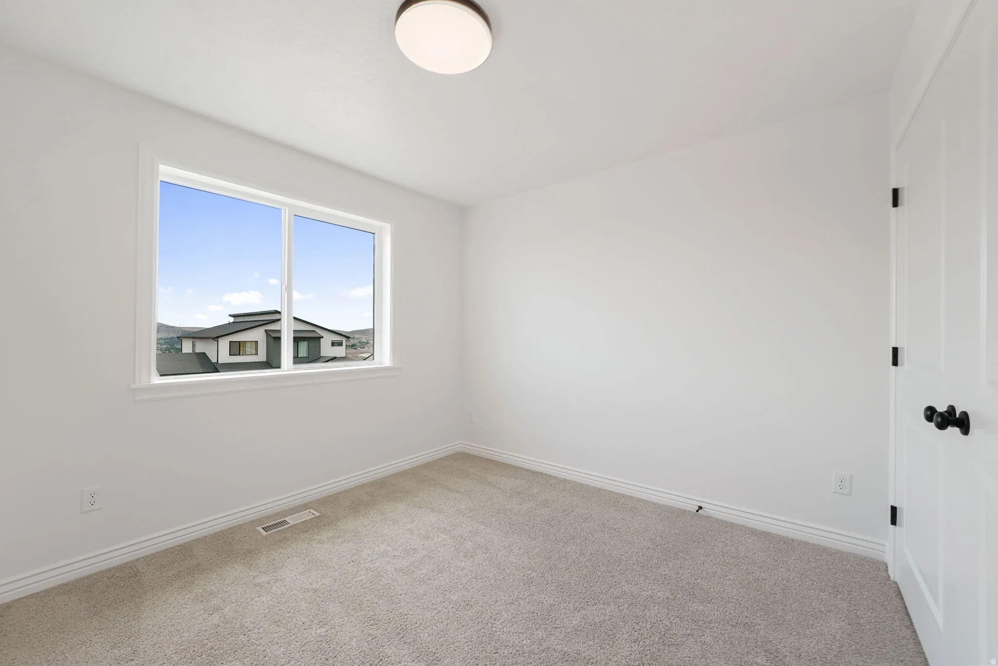 Neutral wall tones with a white trim package