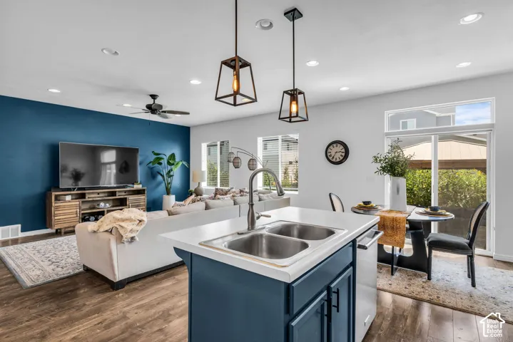 Kitchen island with dual stainless steel sinks and a chrome faucet