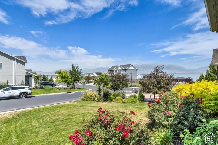 Landscaped foreground featuring vibrant red and yellow shrubbery