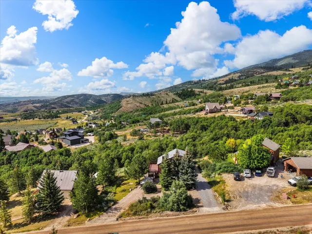 Expansive mountain landscape with scattered residential properties