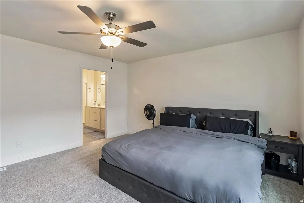 Bedroom featuring neutral wall colors and light gray carpeting