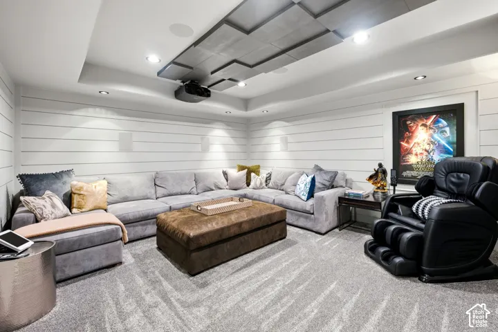 Custom media room featuring shiplap accent walls and recessed lighting
