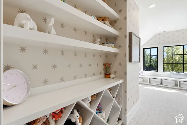Built-in shelving and storage cubbies complement a window seat with natural light