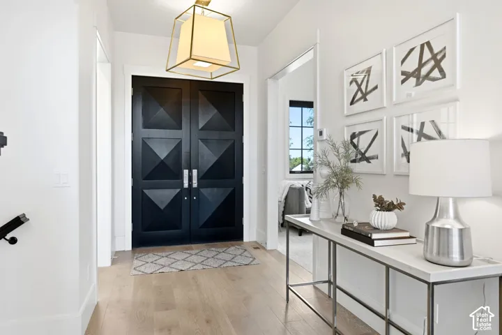 Double entry doors with geometric paneling and brushed nickel hardware