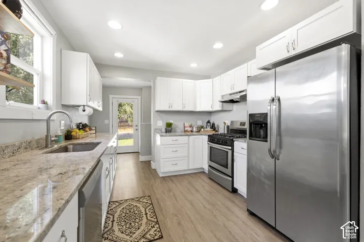 Renovated kitchen with granite countertops.