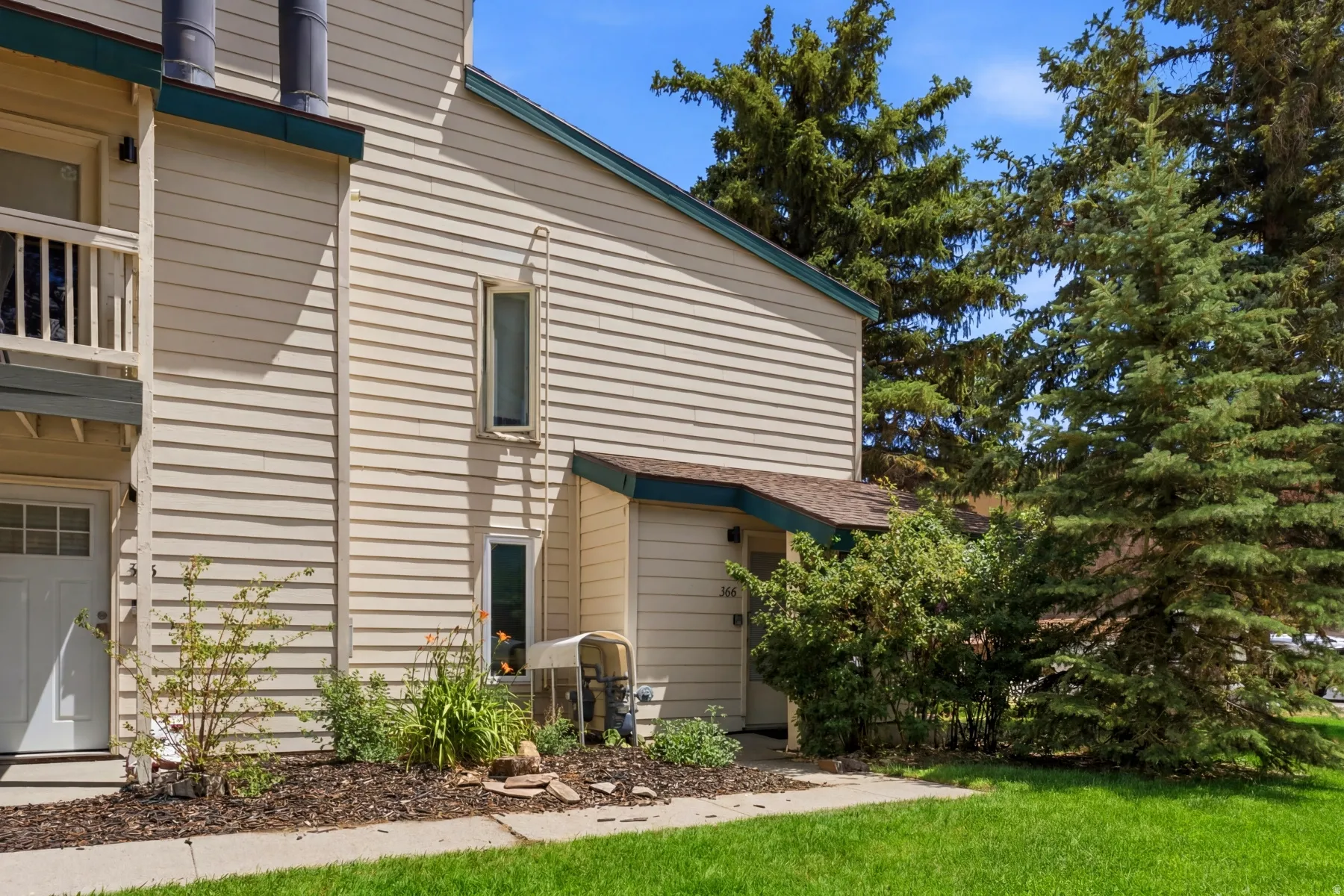 Exterior facade featuring horizontal siding and a covered entry