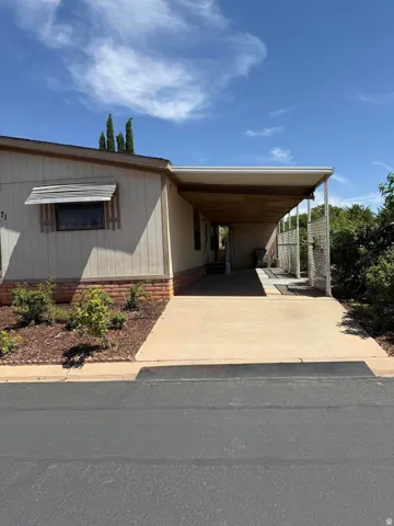 Covered carport with ample parking space