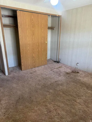 Built-in closet with wood-finish sliding doors