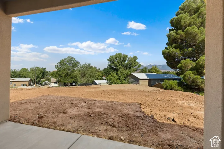 Expansive graded lot with a concrete patio