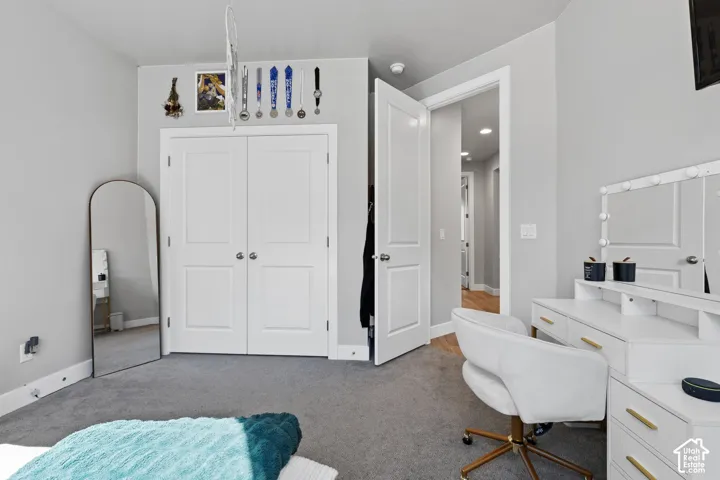 Neutral gray wall paint with white baseboards and white trim around a doorway