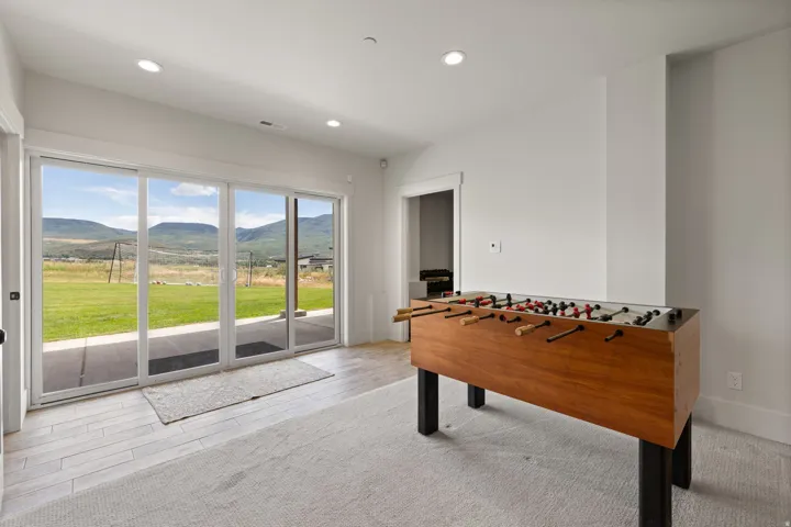 Expansive sliding glass doors provide natural light and direct access to the exterior patio