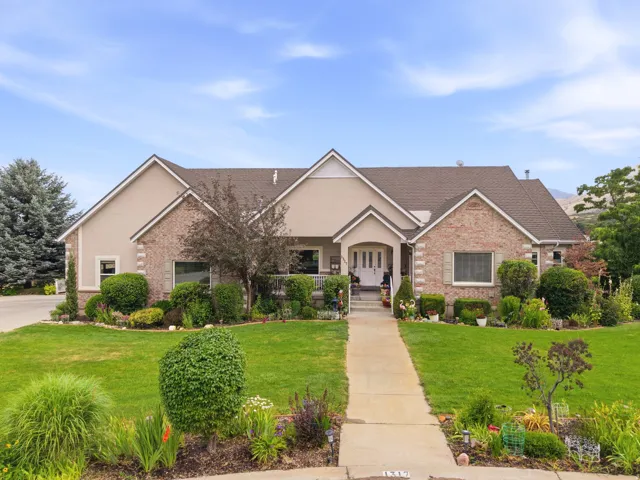 Traditional-style home featuring a brick and stucco facade