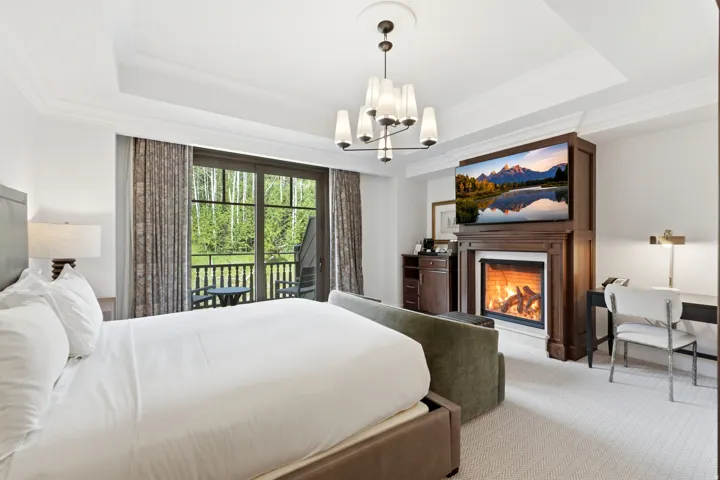 Tray ceiling with crown molding and a contemporary chandelier