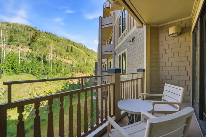 Private balcony featuring a mountain backdrop with extensive tree coverage