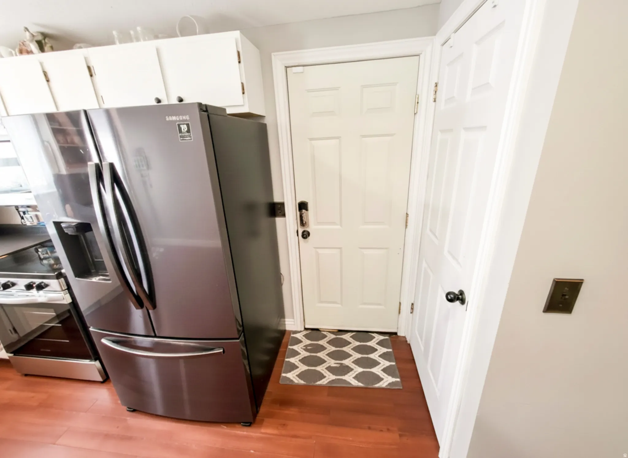 Attached garage entry from kitchen at center.