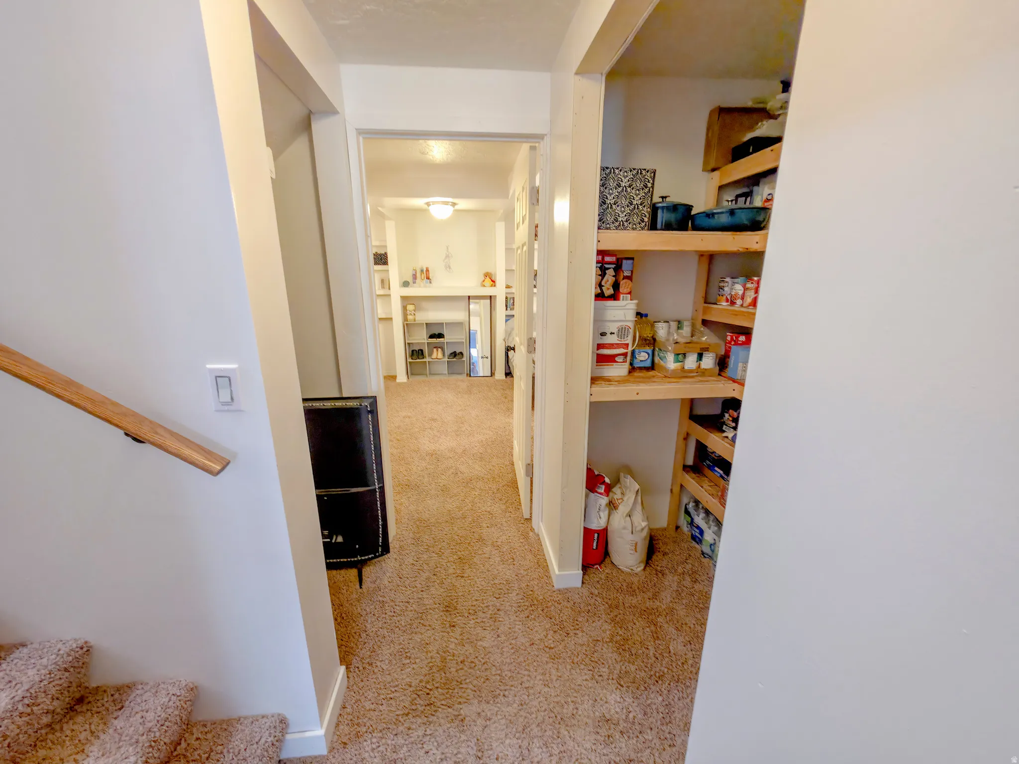 Stairs on left. Then storage. Family room 2 center. Storage on right.