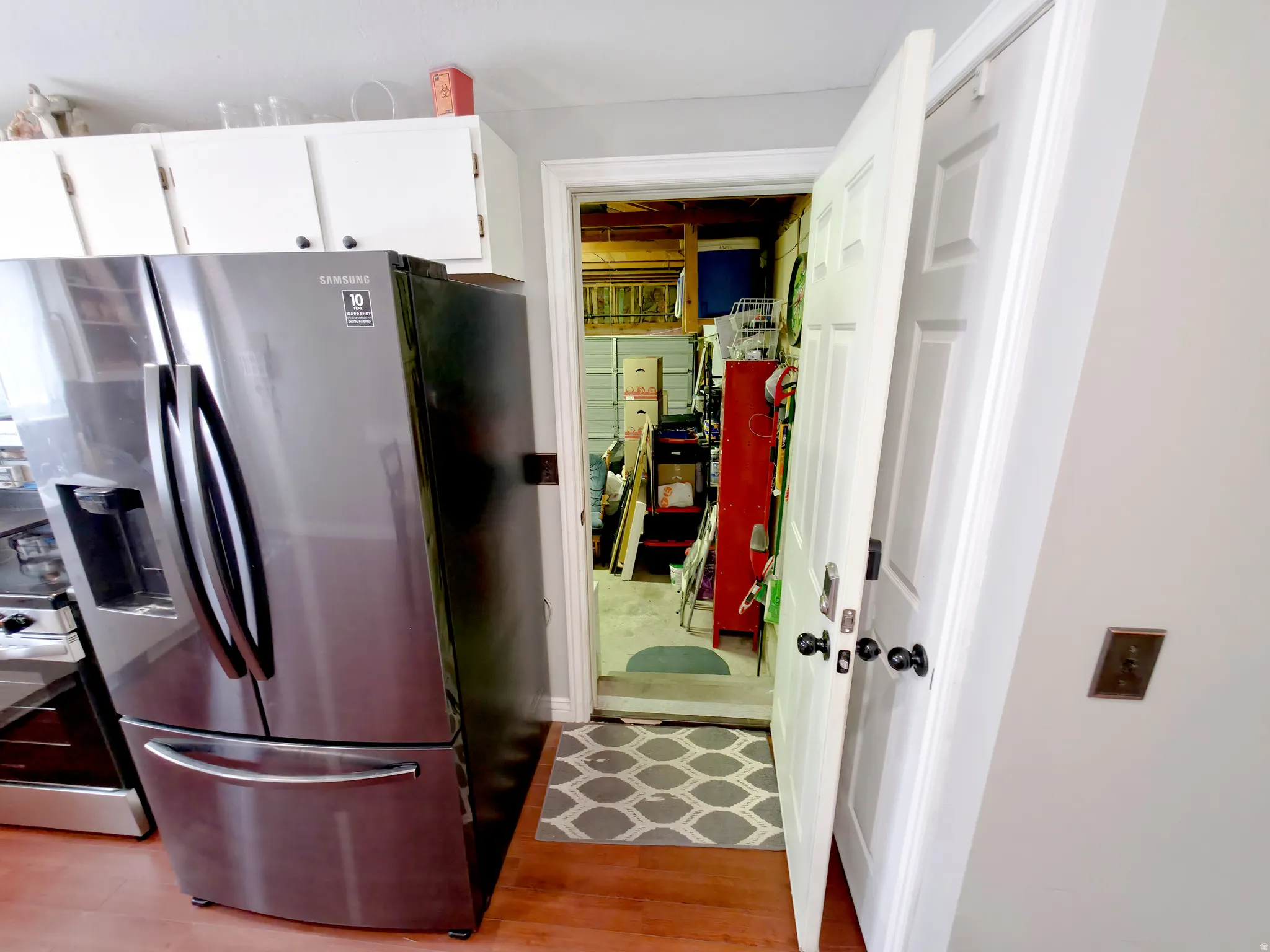Attached garage entry from kitchen at center.