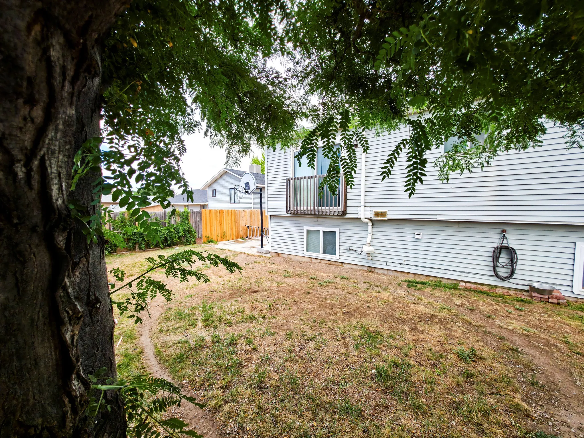 Backyard: RV/patio left, home center.