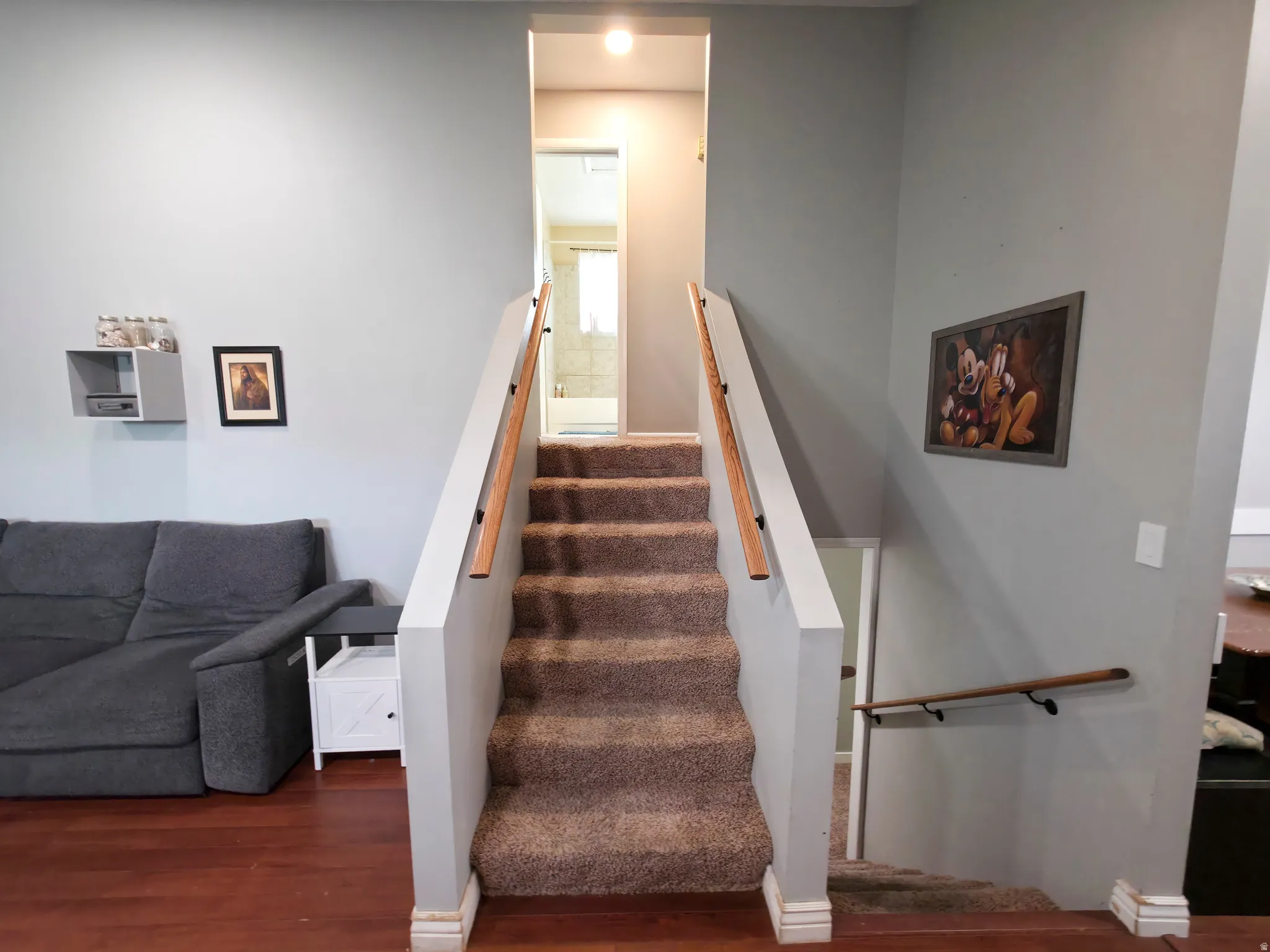 Stairs up to level 2. Bathroom center.