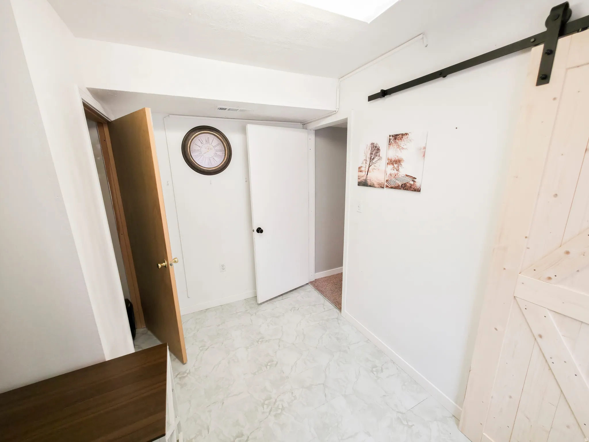 Bedroom 3: closet on left and hallway at center. Laundry/mechanical on right.