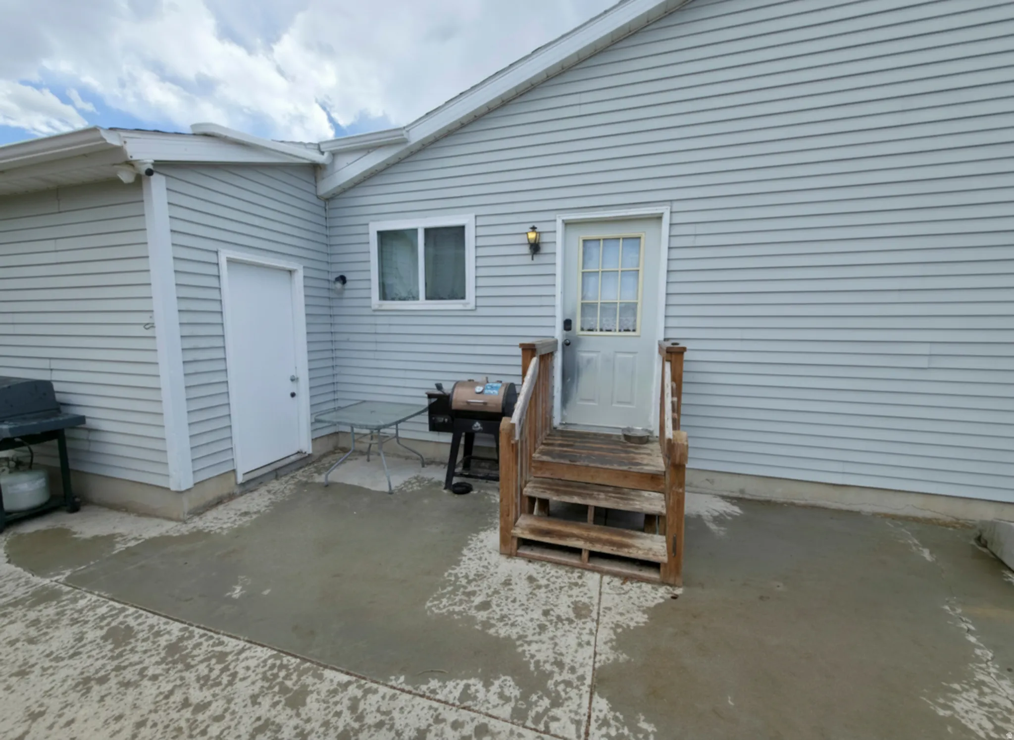 Man door to garage on left. Kitchen entry center.