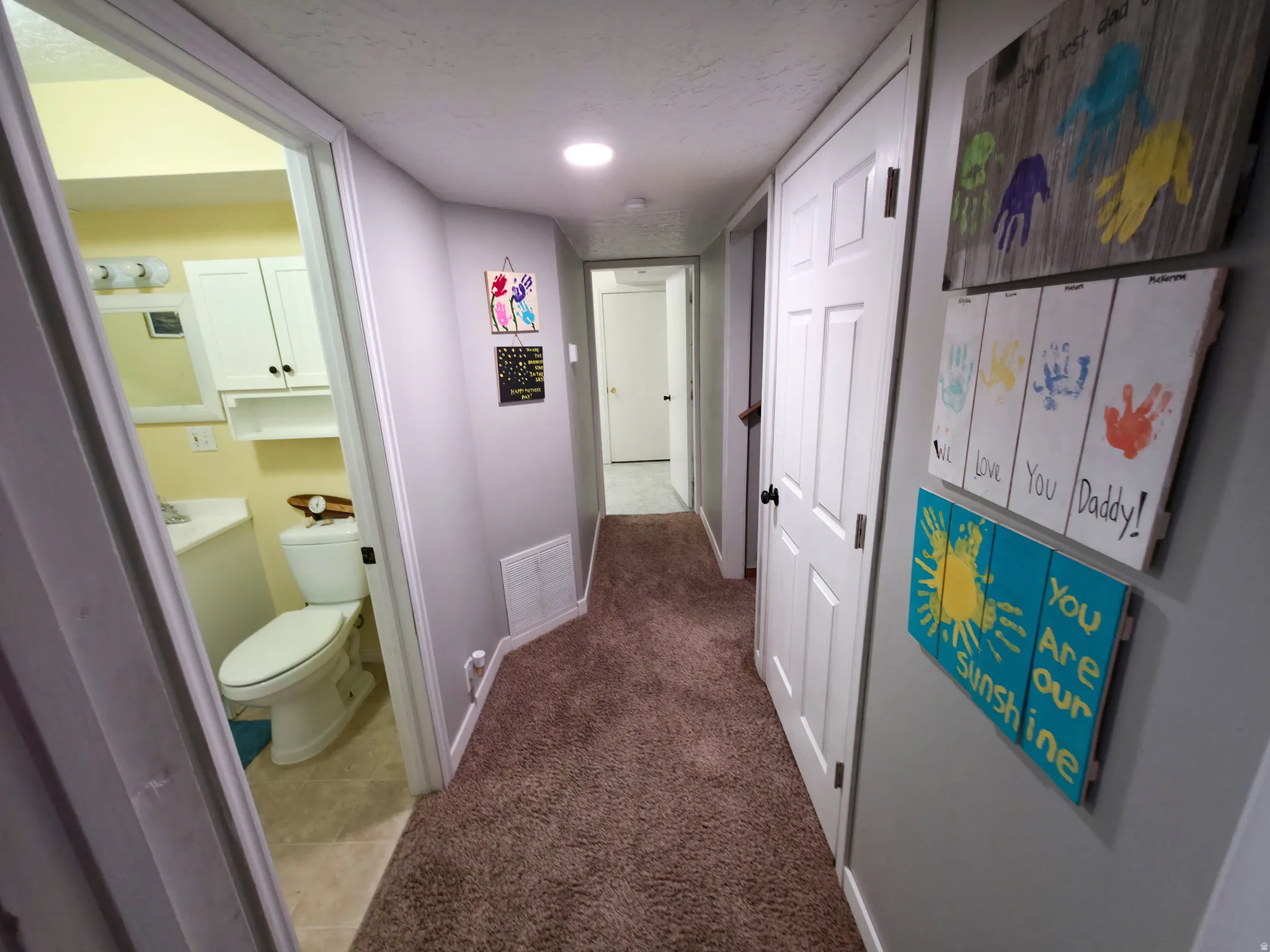 Bathroom 2 at left. Bedroom 3 center. Stairs on right.