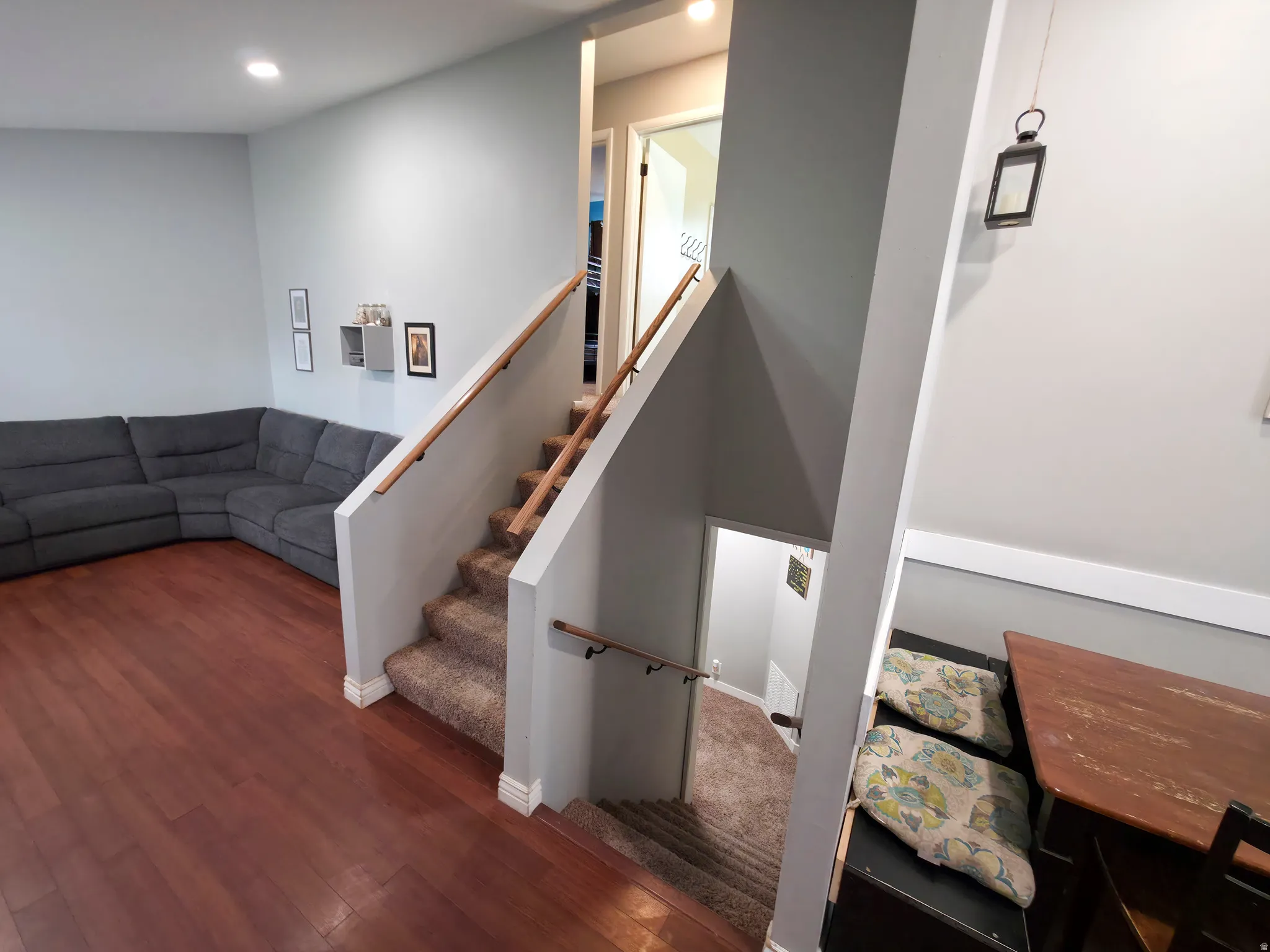 Stable oak double handrails on stairs.