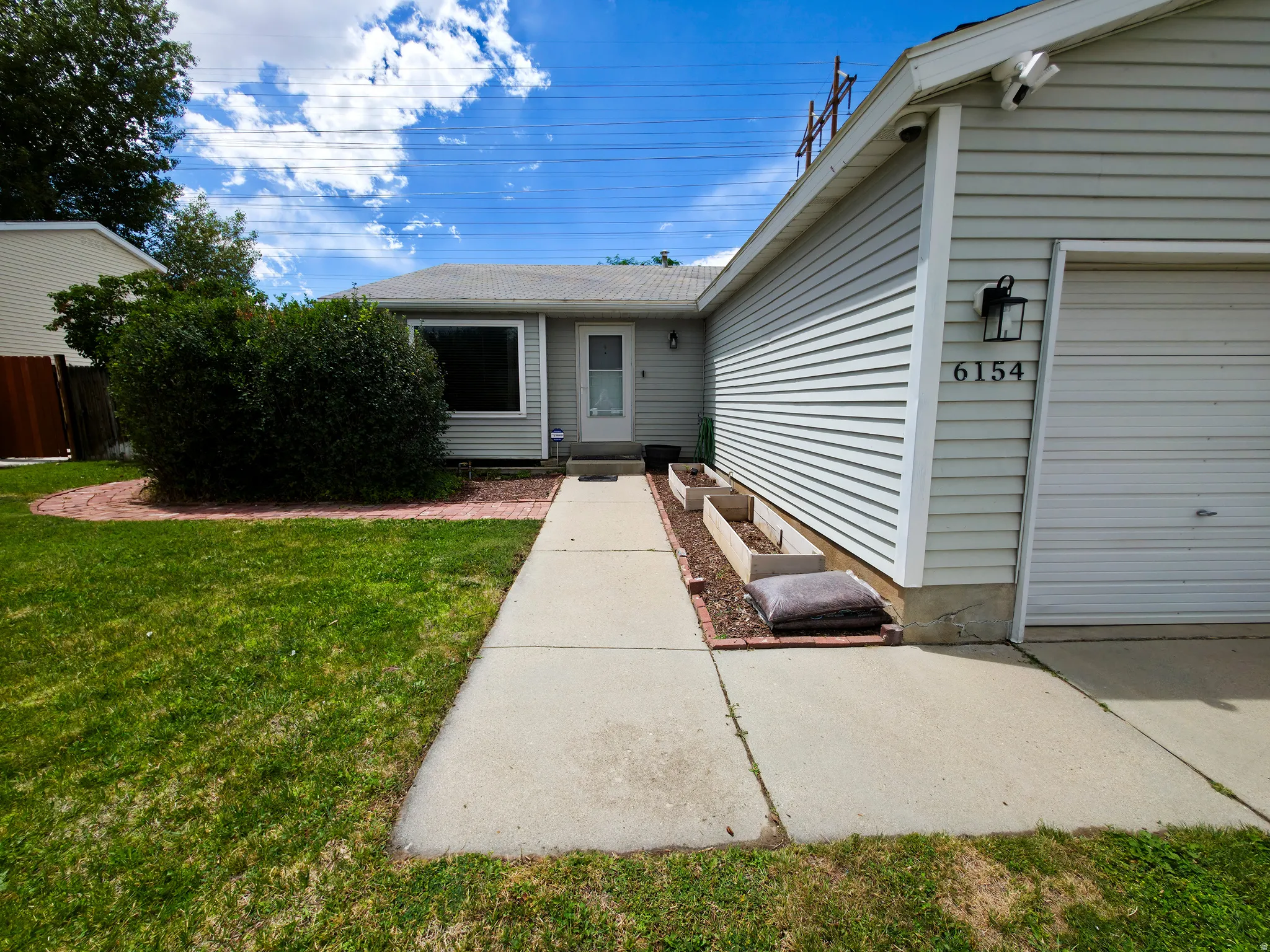 Attached garage on right side.
