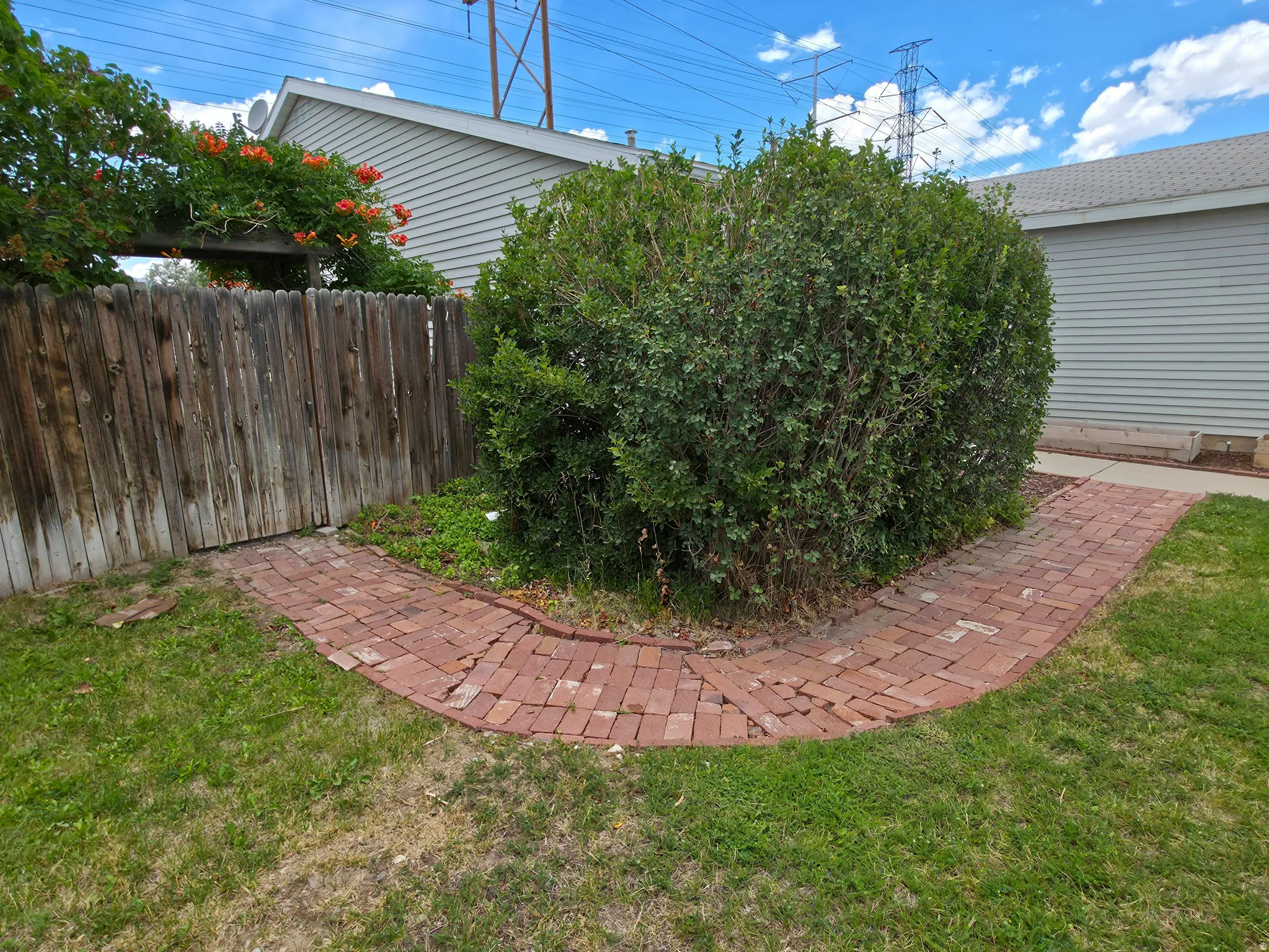 Brick pathway from entry to side gate.
