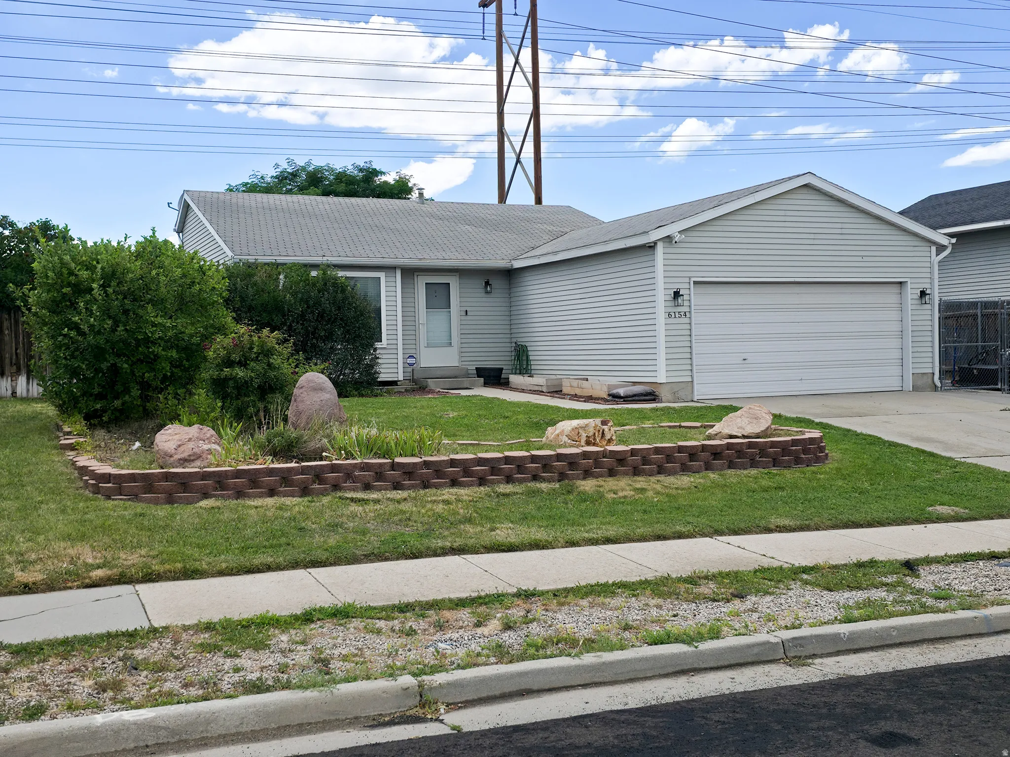 Terraced front yard with garden.