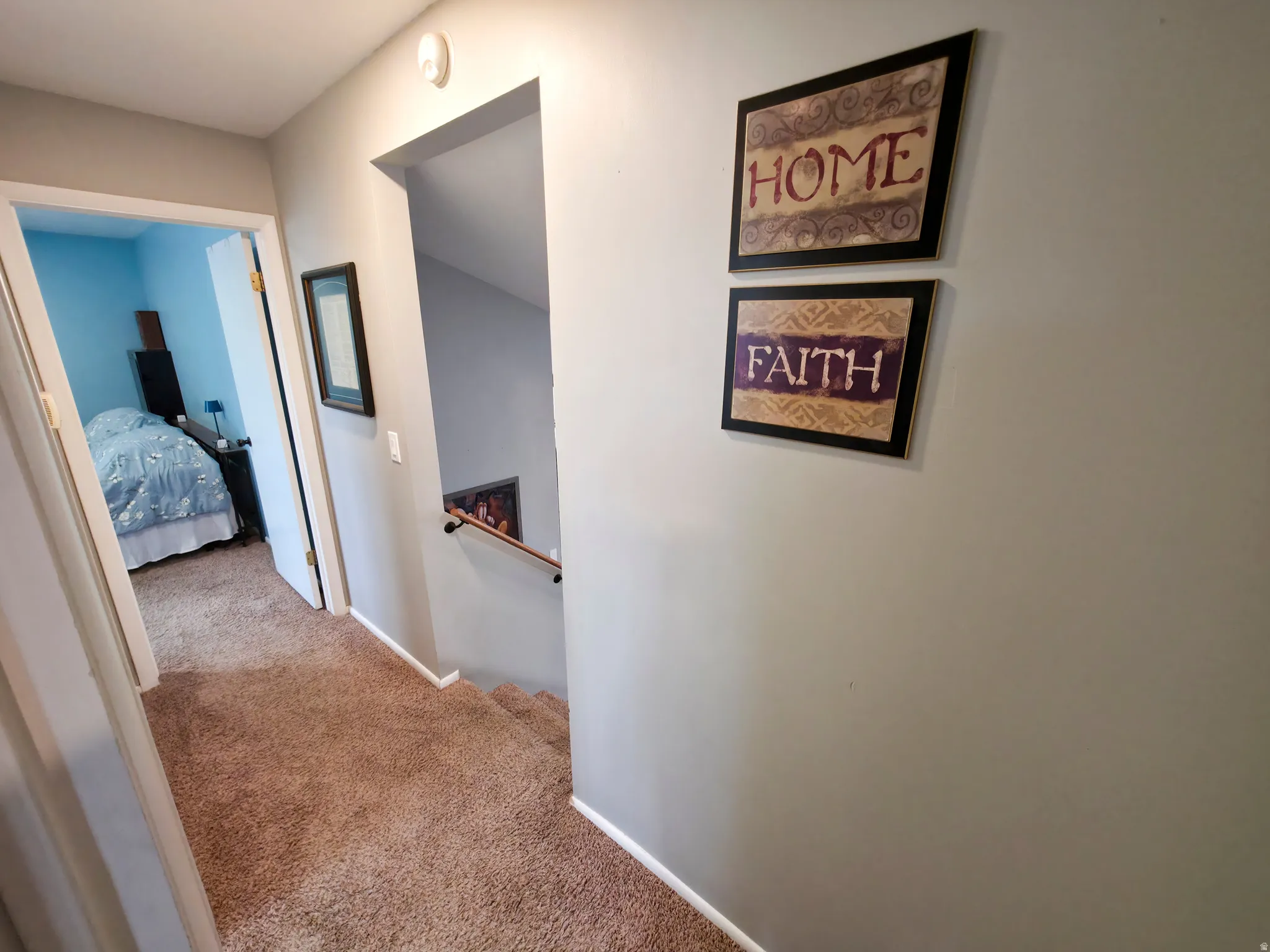 Bathroom 1 at left. Primary bedroom center. Stairs down on right.