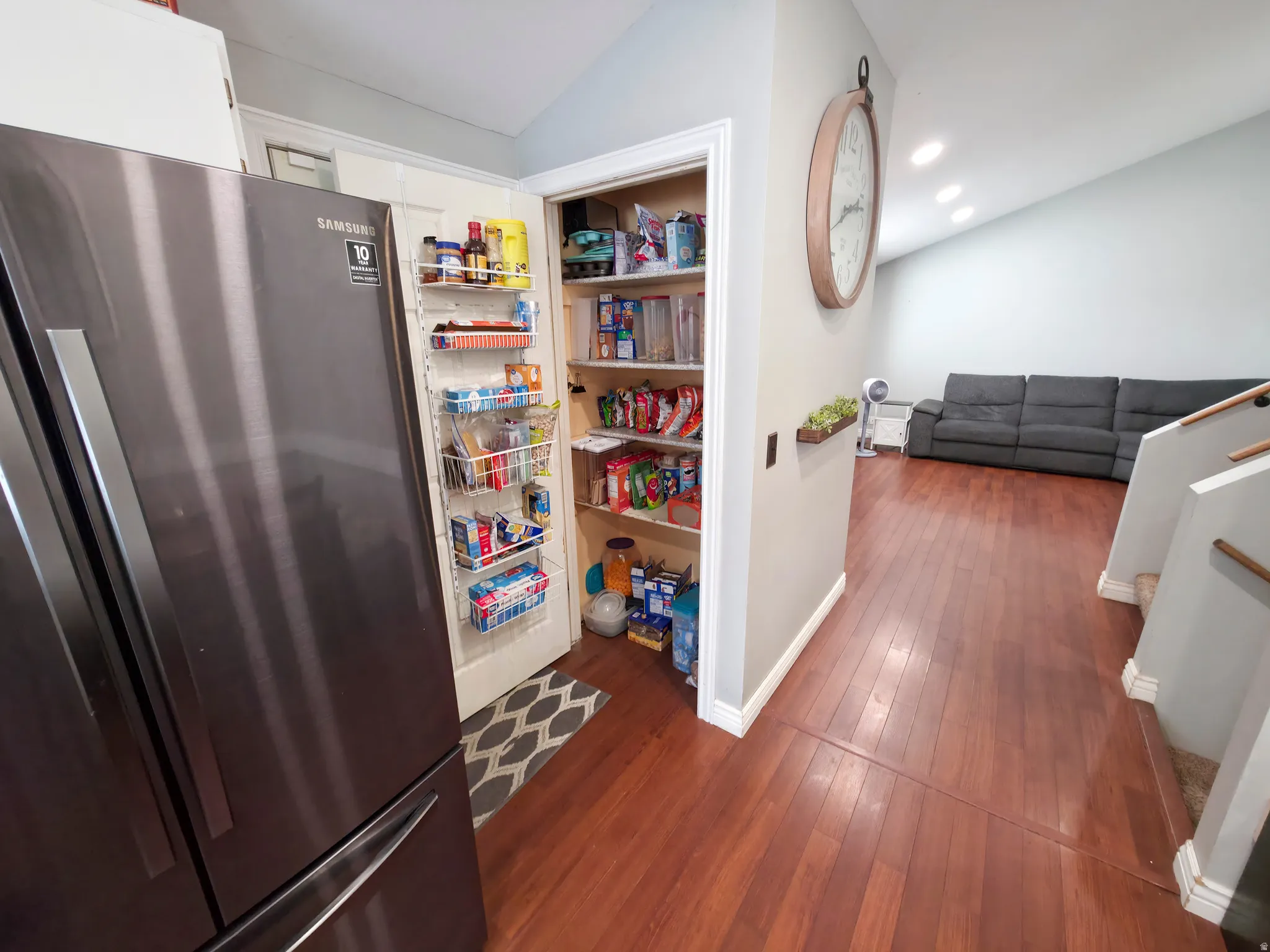 Pantry in kitchen. Stairs on right.