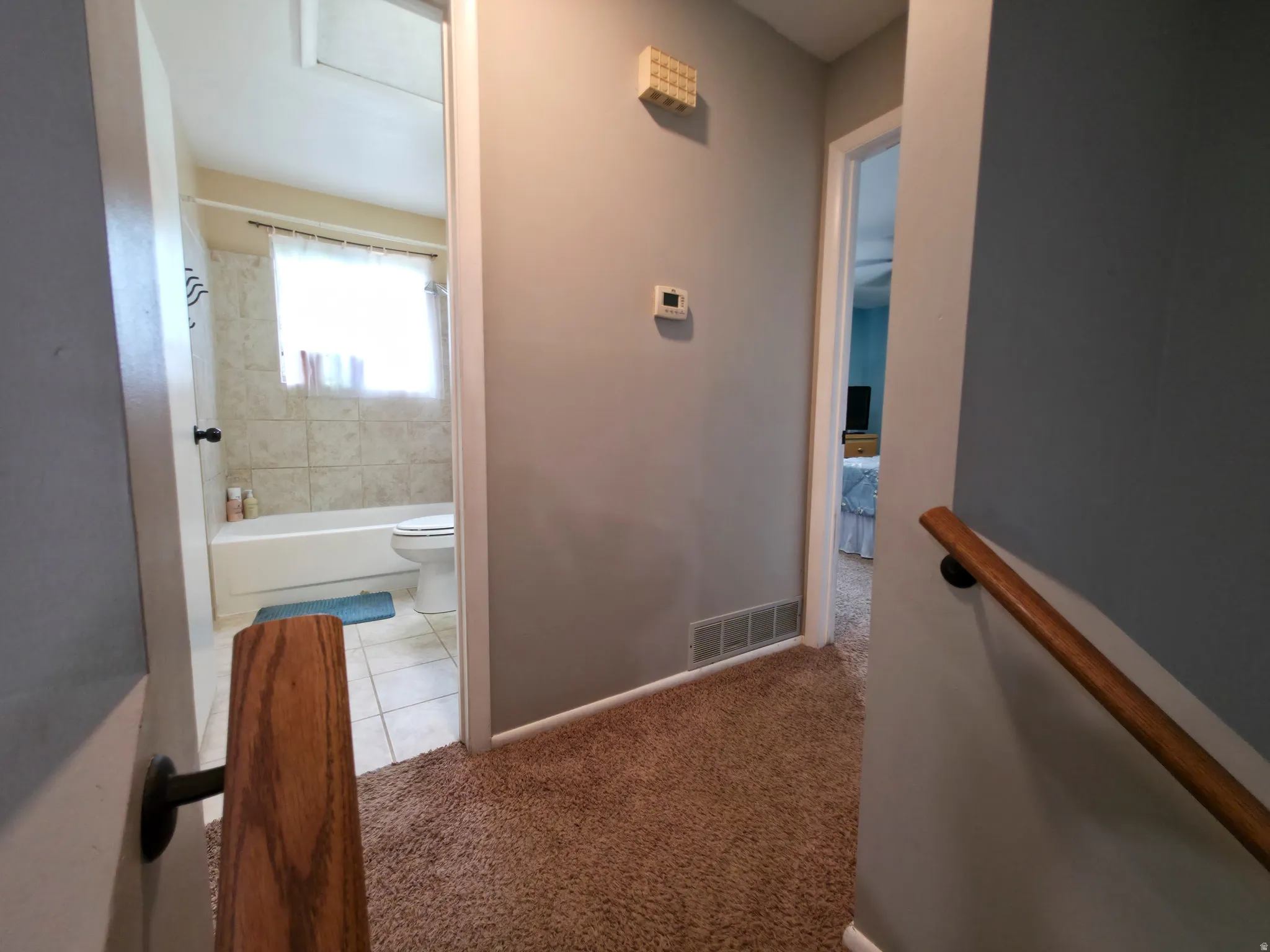 Bathroom center. Primary bedroom on right.