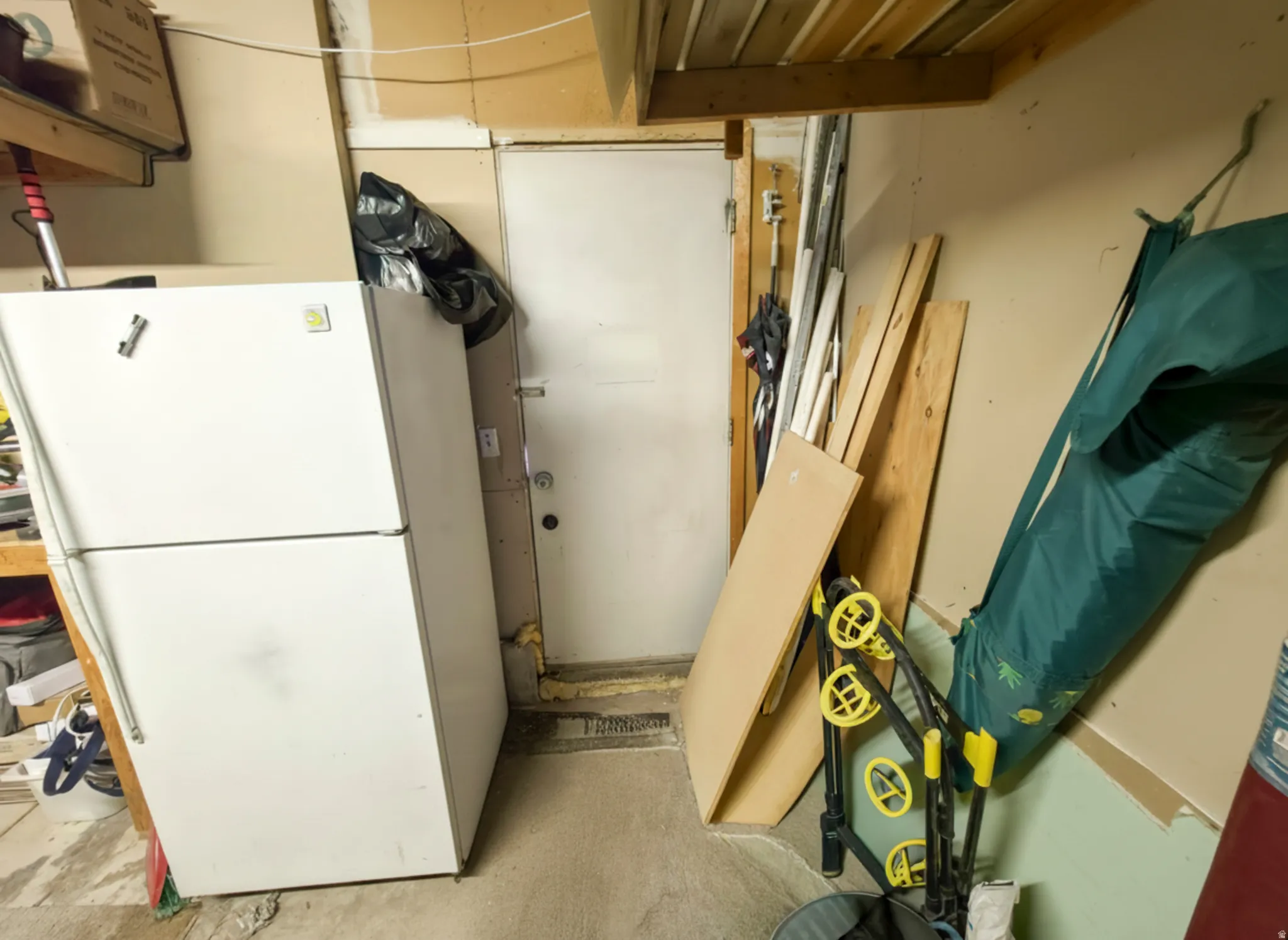 Garage fridge INCLUDED! Man door to back yard from garage.