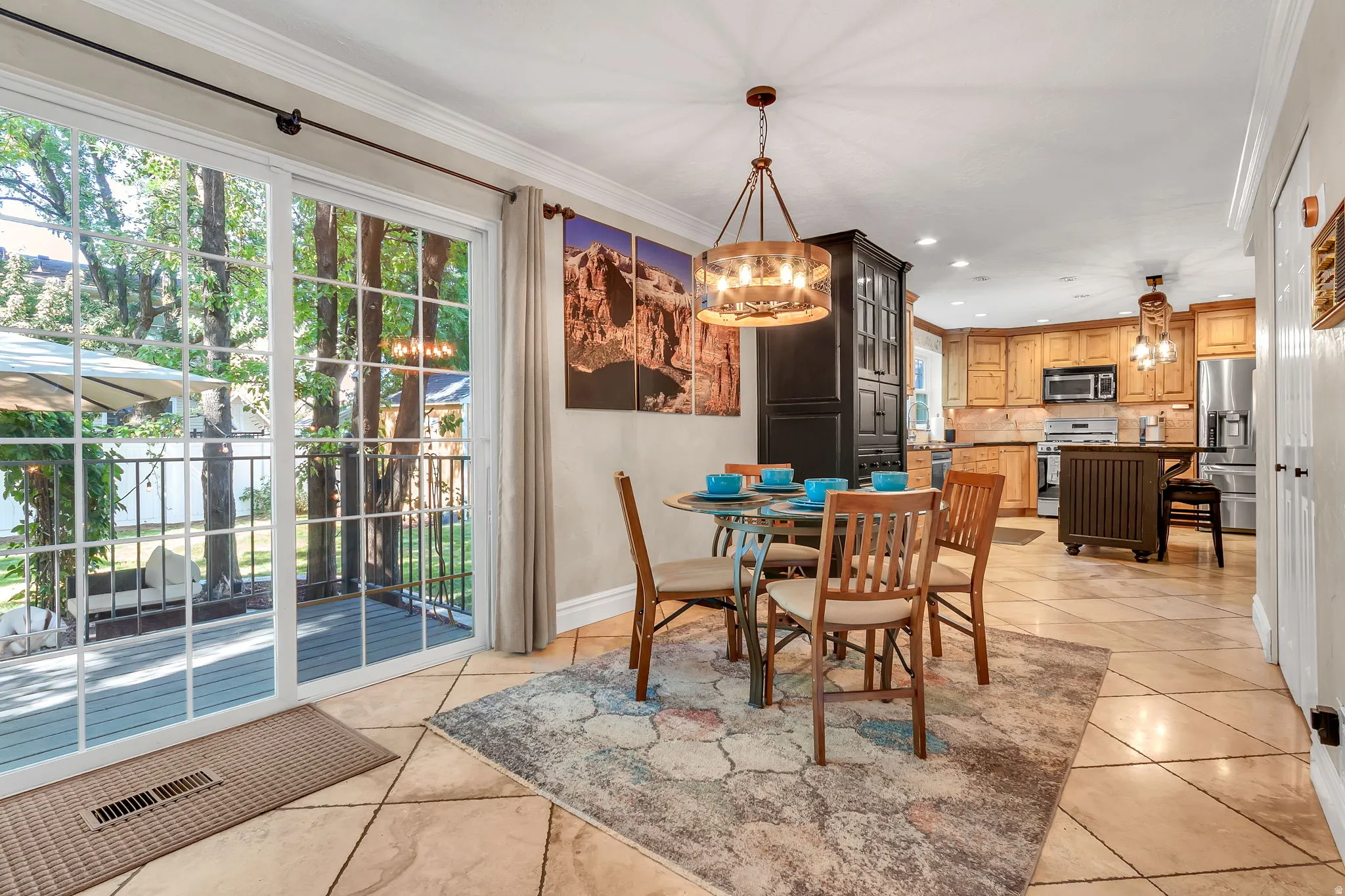 Sliding glass doors opening to an outdoor deck, providing abundant natural light