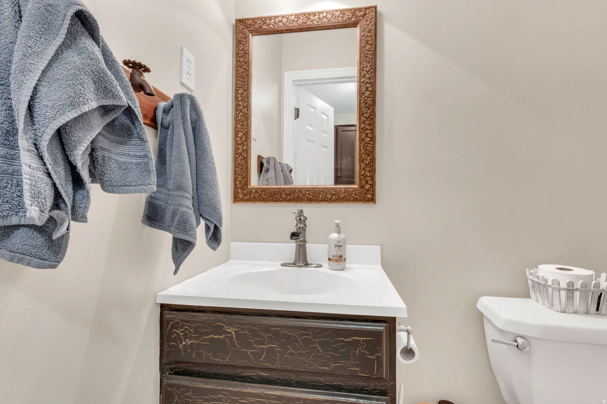 Main level Bathroom 1 vanity with a white countertop and integrated sink